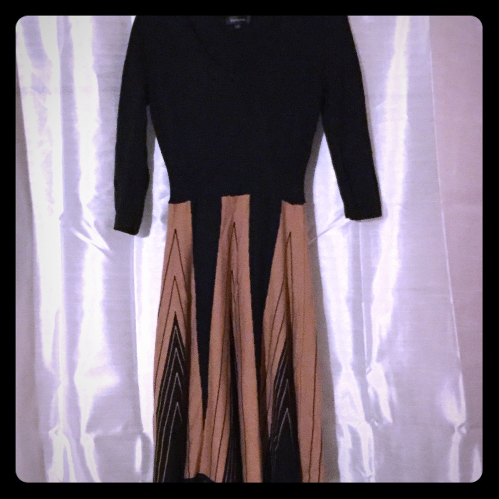 A-Line dress with mid length sleeves.